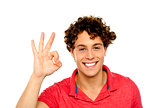 Curly hair guy gesturing excellence sign