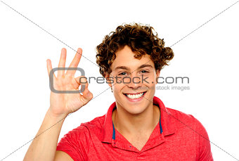 Curly hair guy gesturing excellence sign