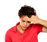 Stressed out guy with hand on his forehead