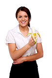 Business woman eating a banana