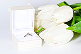 White spring tulips with box with diamond ring