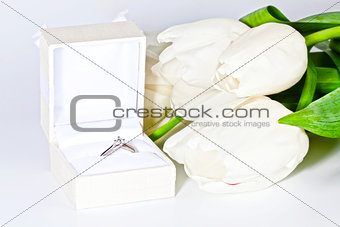 White spring tulips with box with diamond ring