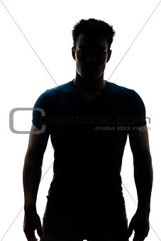Male figure in silhouette looking at the camera