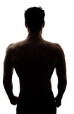 Muscular man's back in silhouette