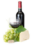 Red wine glass, bottle, cheese and grapes