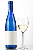 Blue bottle of white wine and wine glass
