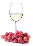 White wine glass with red grapes