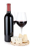 Various types of cheeses and red wine