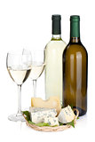White wine bottles, two glasses and cheese