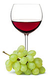 Red wine in glass with grape branch