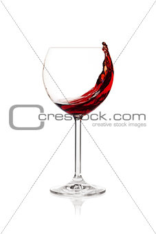 Splashing red wine in a glass
