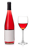 Rose wine in a glass and bottle