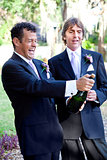 Gay Couple Opening Champagne