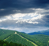 Beautiful green mountain landscape under dramatic sky in Carpath