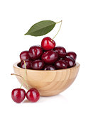 Ripe cherries in a wooden bowl