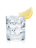 Glass of pure water with ice cubes and lemon slice