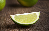 Fresh lime on wooden background