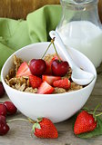grain muesli with strawberries and cherries - a healthy breakfast