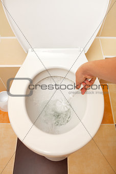 Hand washing the toilet