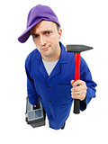 Awkward repairman with hammer