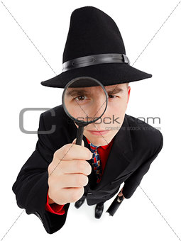 Young detective with magnifier