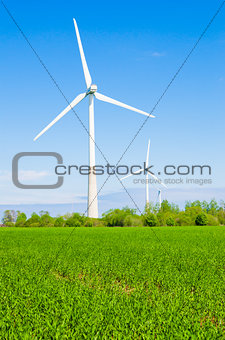 Summer landscape with wind generators  
