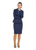 Full length portrait of happy business woman looking on copy spa