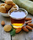 Dessert liqueur Amaretto with almond biscuits (amarittini) and nuts