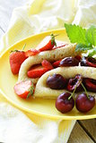 dessert crepes with berries cherries and strawberries