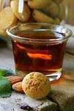 Dessert liqueur Amaretto with almond biscuits (amarittini) and nuts