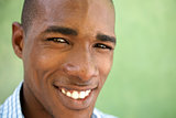 Portrait of happy young black man looking at camera and smiling