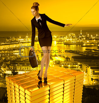 worried business woman on gold tower and town
