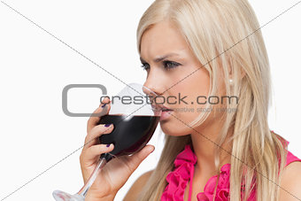 Blonde drinking a glass of wine