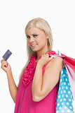 Blonde holding shopping bags and a card