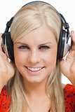Smiling blonde listening to music