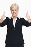 Smiling blond businesswoman thumbs-up
