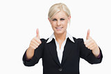 Smiling blonde businesswoman thumbs-up