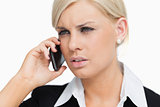 Serious blond businesswoman on the phone