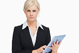 Serious businesswoman holding a tablet computer