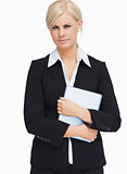 Serious businesswoman holding a tablet