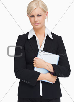 Serious businesswoman holding a tablet