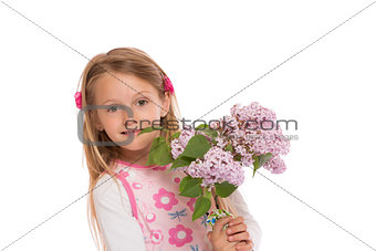 Happy little girl with lilac flowers