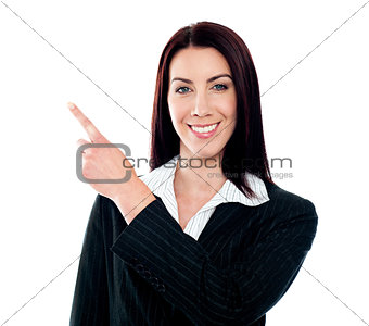 Business lady pointing at copyspace