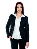 Stylish businesswoman posing with hand in pocket