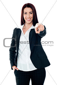 Smiling corporate lady pointing at you