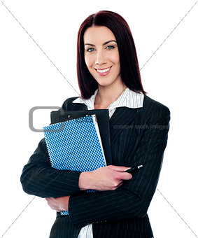 Portrait of smart smiling secretary holding file