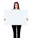 Caucasian businesswoman holding a blank billboard