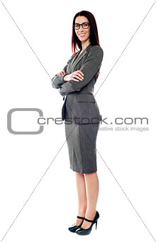 Sucessful businesswoman posing with folded arms