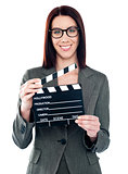 Business lady holding clapperboard