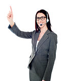 Female executive pointing up at copyspace